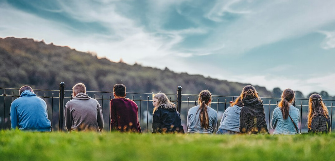 Group of coworkers sitting together listening attentively